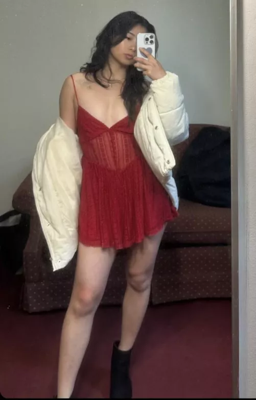 red dress in front of a dirty mirror