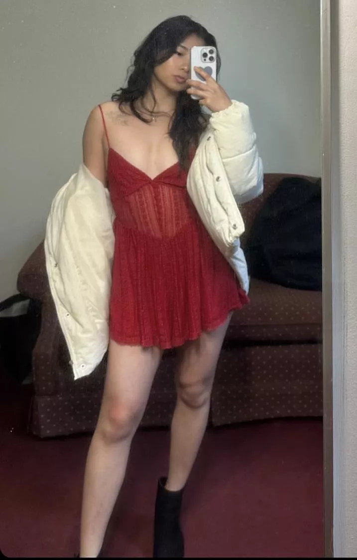 red dress in front of a dirty mirror