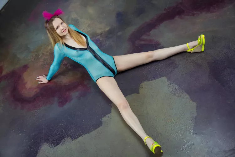 in a turquoise bodysuit