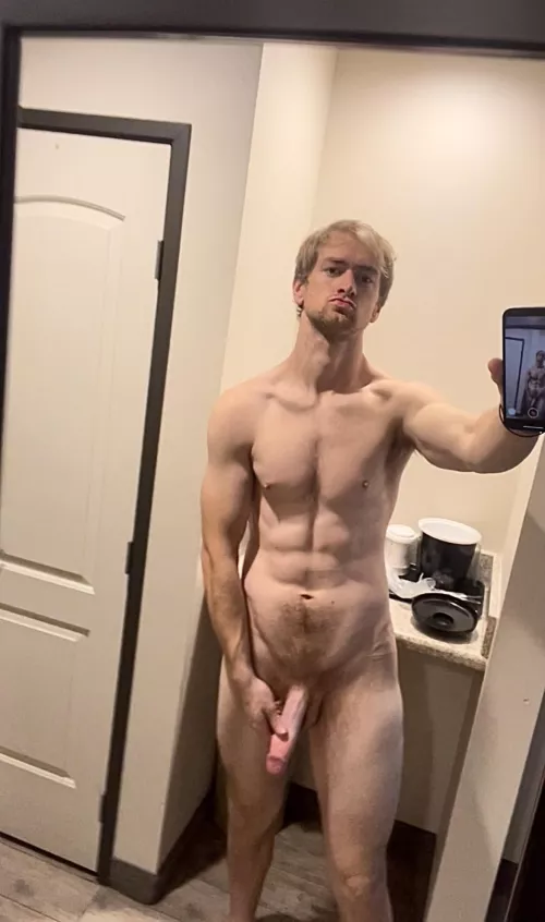 Man looks at man in the mirror