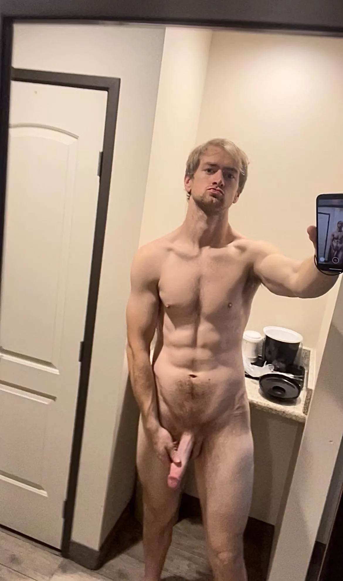 Man looks at man in the mirror