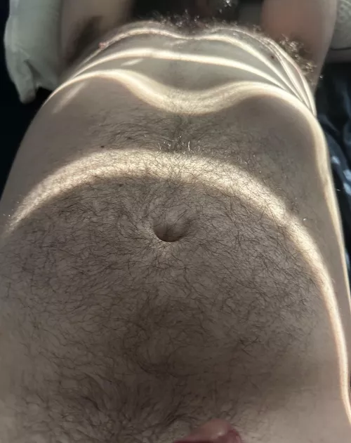 My hubs hairy chest in the sun.