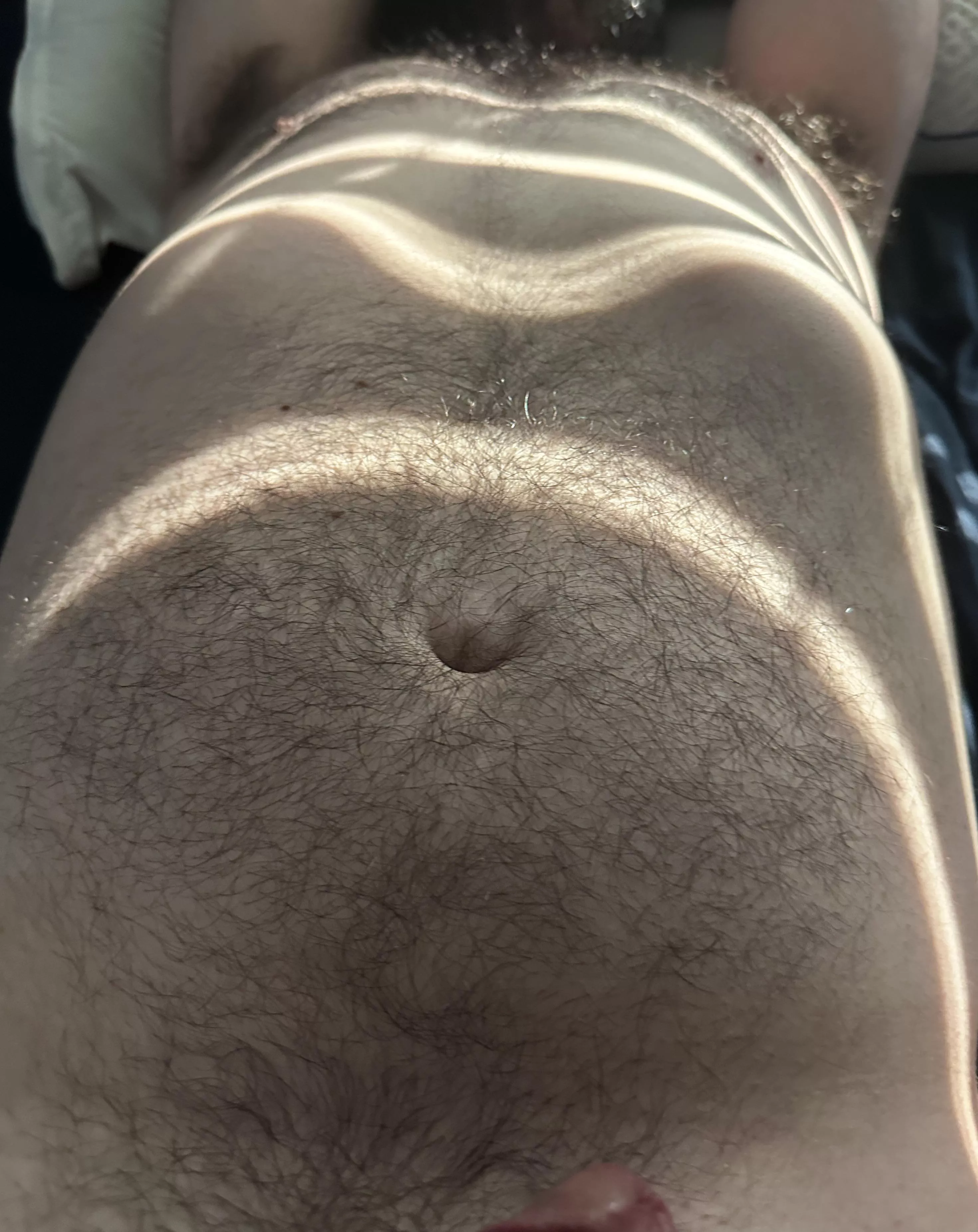 My hubs hairy chest in the sun.