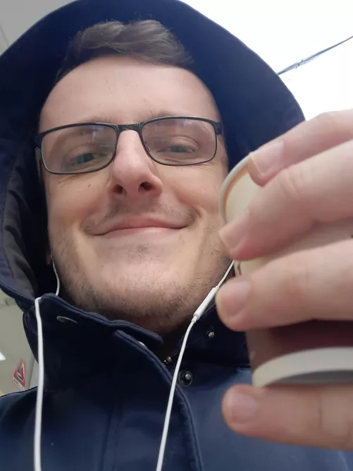 I took this picture of me this morning, right after getting my coffee. on my way to my new job, a job that has been my dream ever since college. I am finally a Technical Writer.