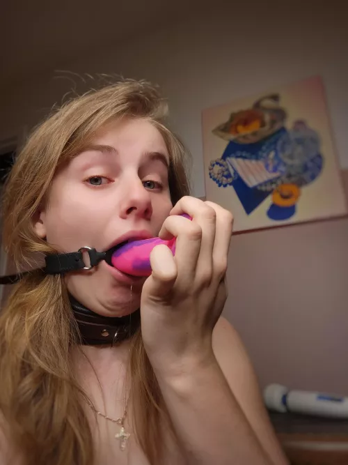 My ring gag fits my pretty pink dildo, isn't that convenient...