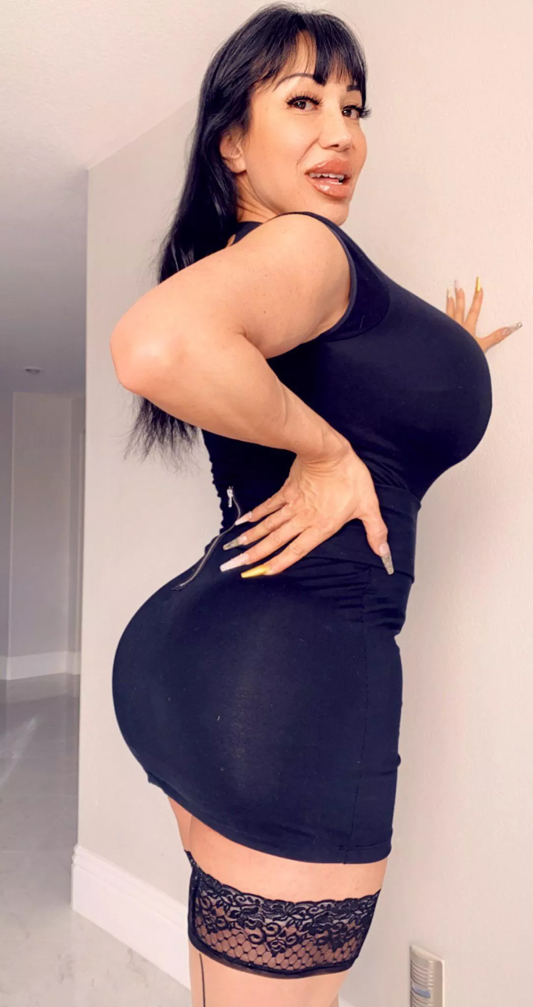 Drives me nuts how far her fake ass and jugs push her clothes out!