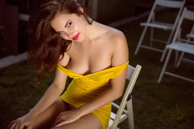 in the sun with a seductive smile