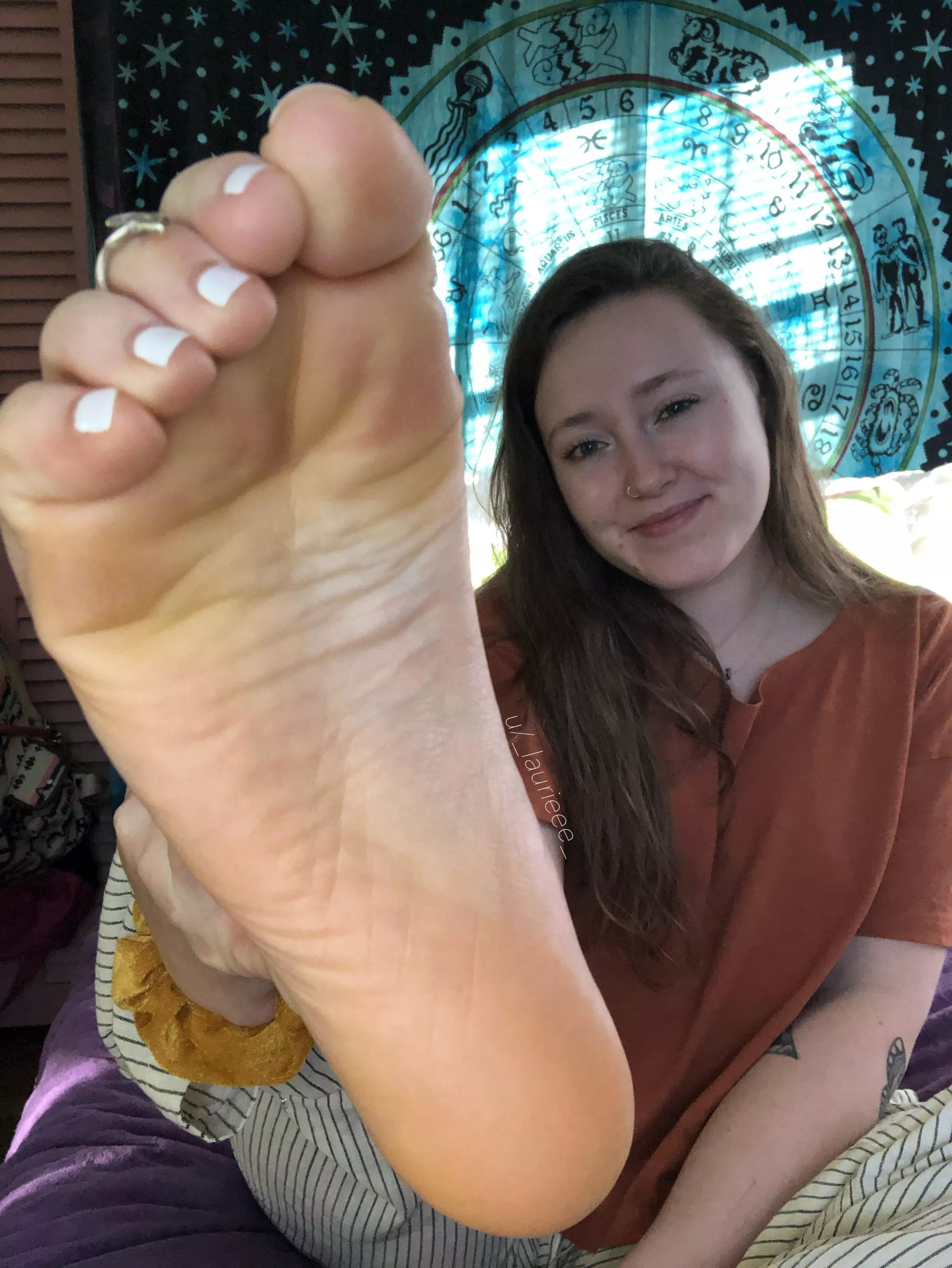 White toes and a scrunched sole coming to rest on your face!