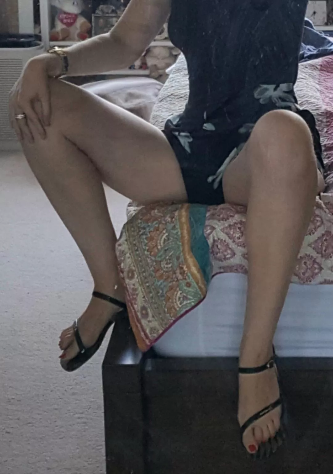 Legs spread with sandal-feet