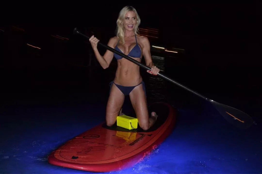 Blue bikini and nighttime paddle boarding