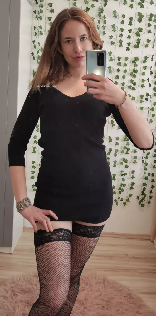 Tight black dress with thigh highs for girls night out