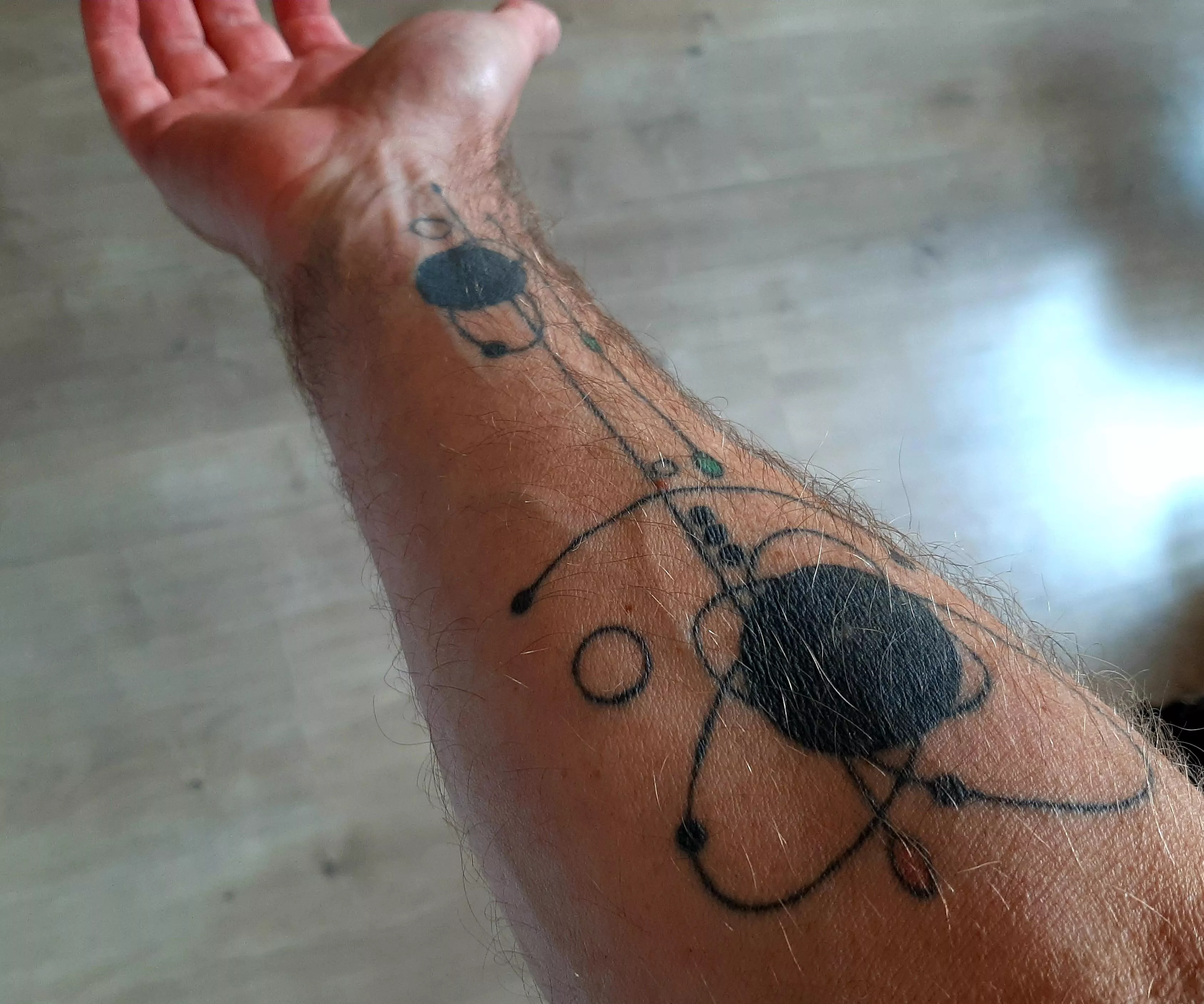My forearm with self-designed tattoo.