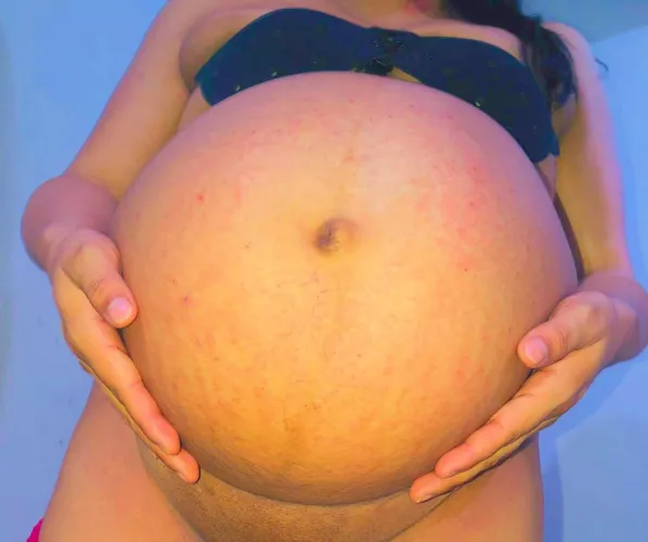 Can you hold my belly and rub me some lotion