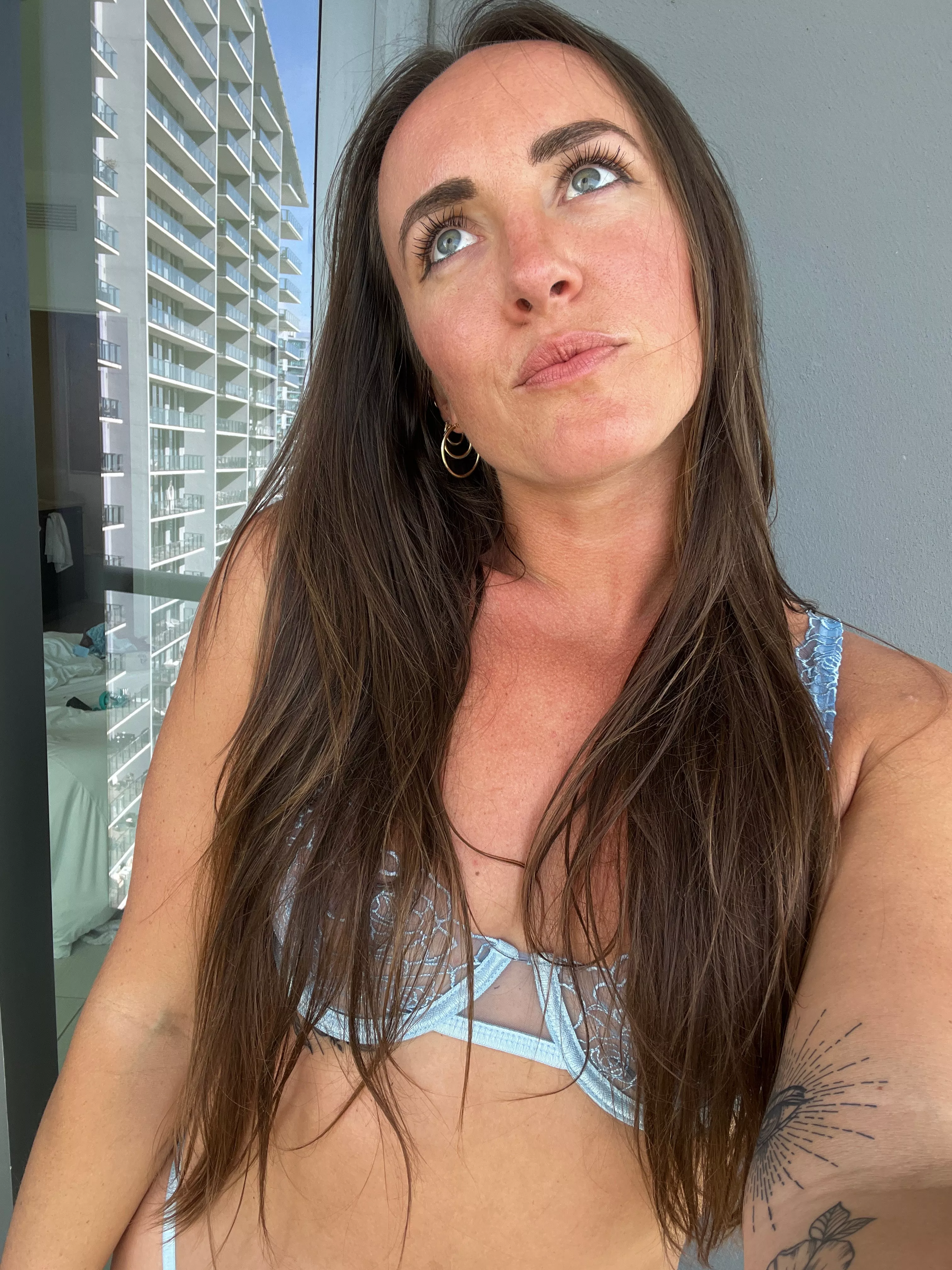 on the balcony in lingerie, I wonder what the neighbors think