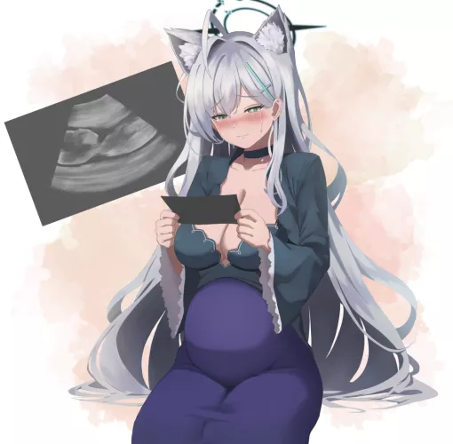 Happy Mother looking at the Ultrasound photo of her baby
