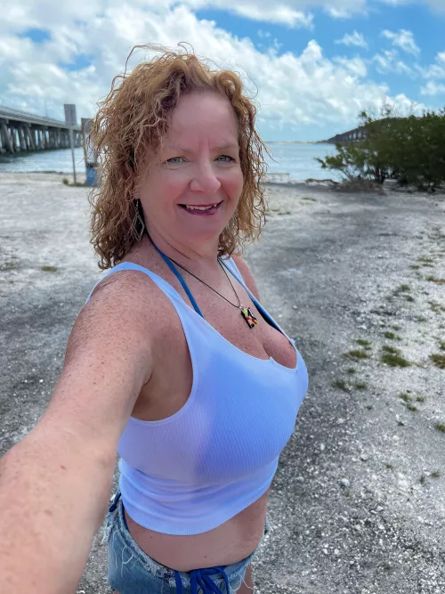 The sun makes my freckles grow together to make me tan.