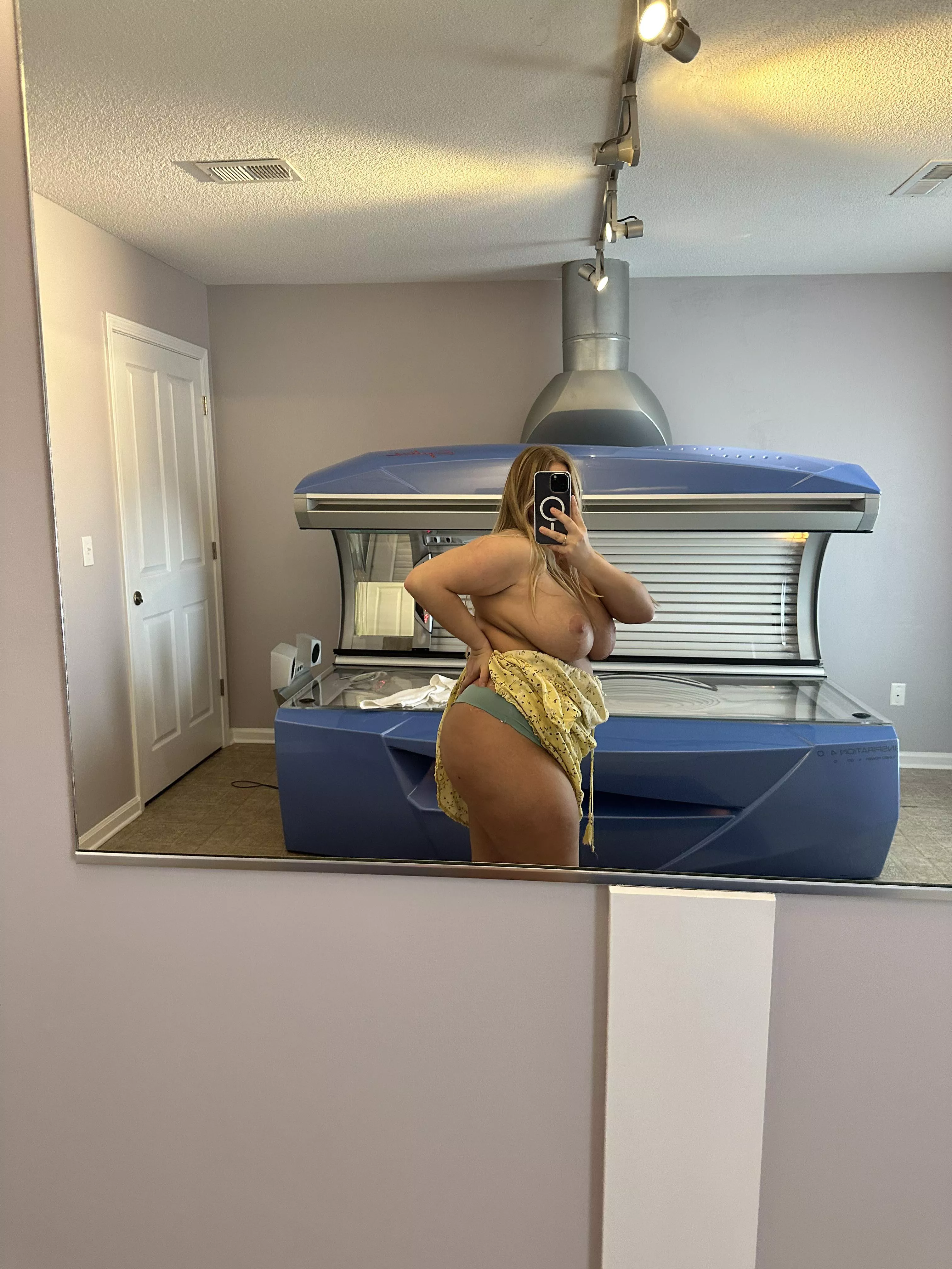 Getting naked in the tanning room.