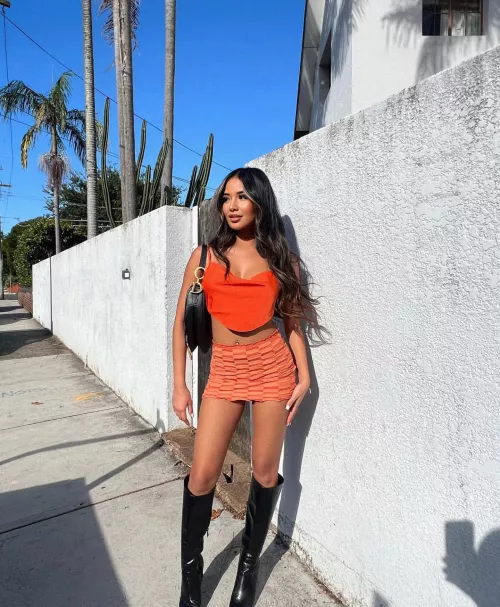 Asian in black boots