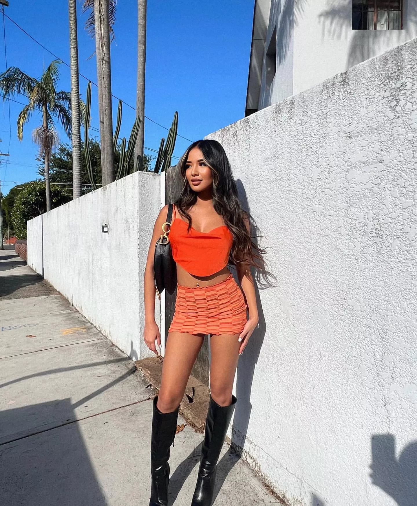 Asian in black boots