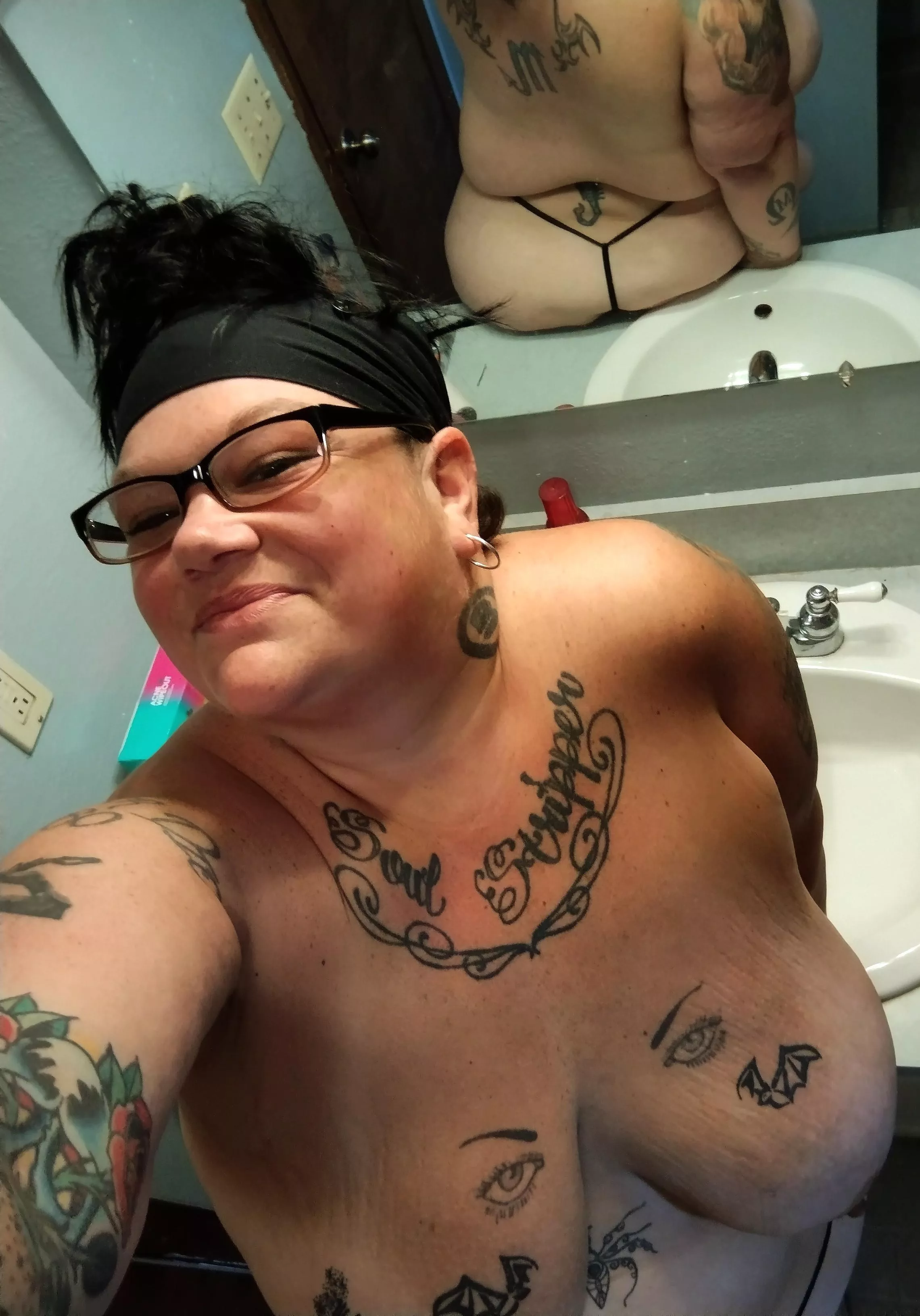 Checking my reflection while I change for my workout