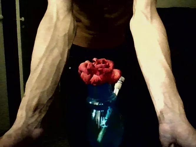 Forearms with flower in foreground🌺😌