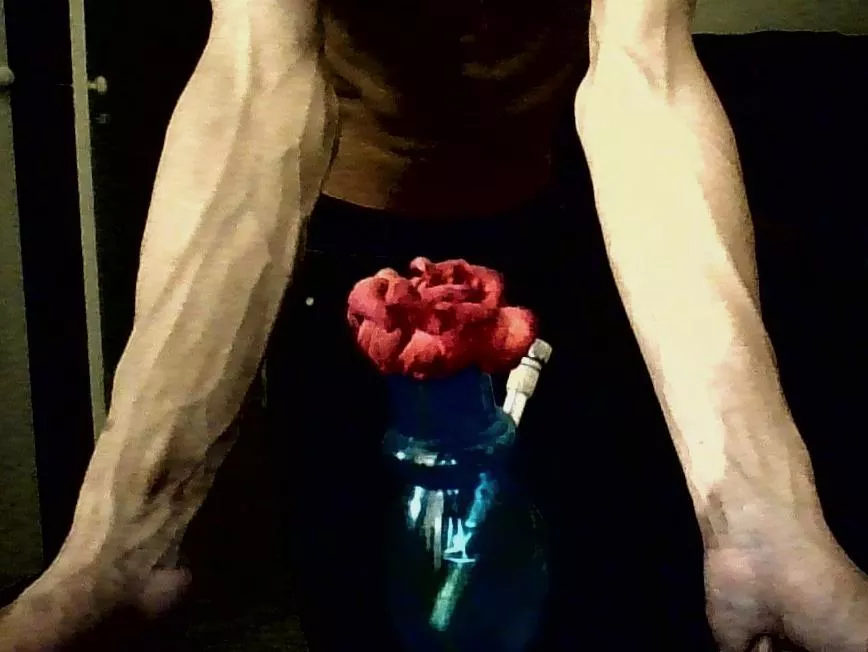 Forearms with flower in foreground🌺😌