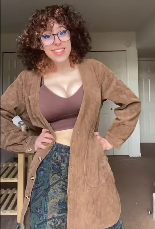 Cute girl with glasses and huge natural tits