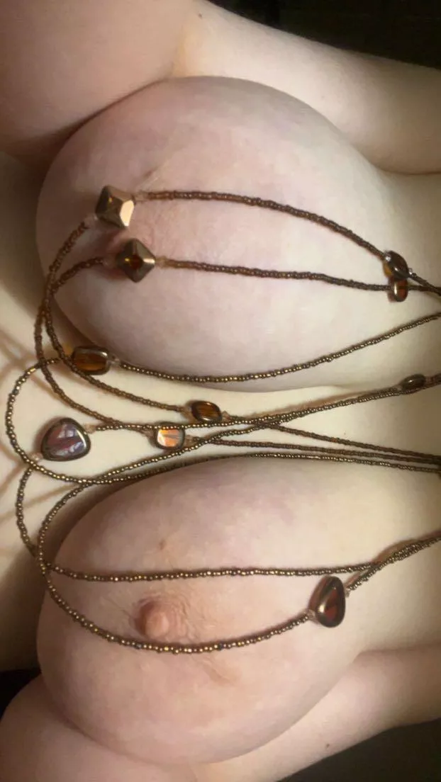 Boobs with brown necklace!