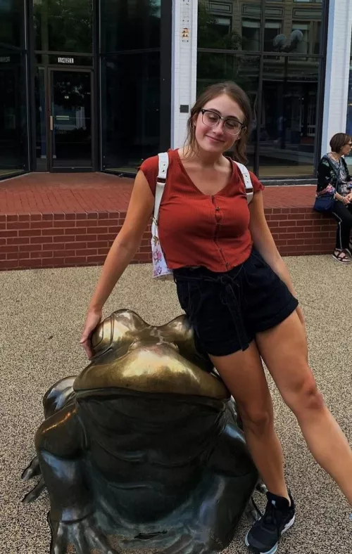 Bra lines under a red top, glasses beauty as a bonus