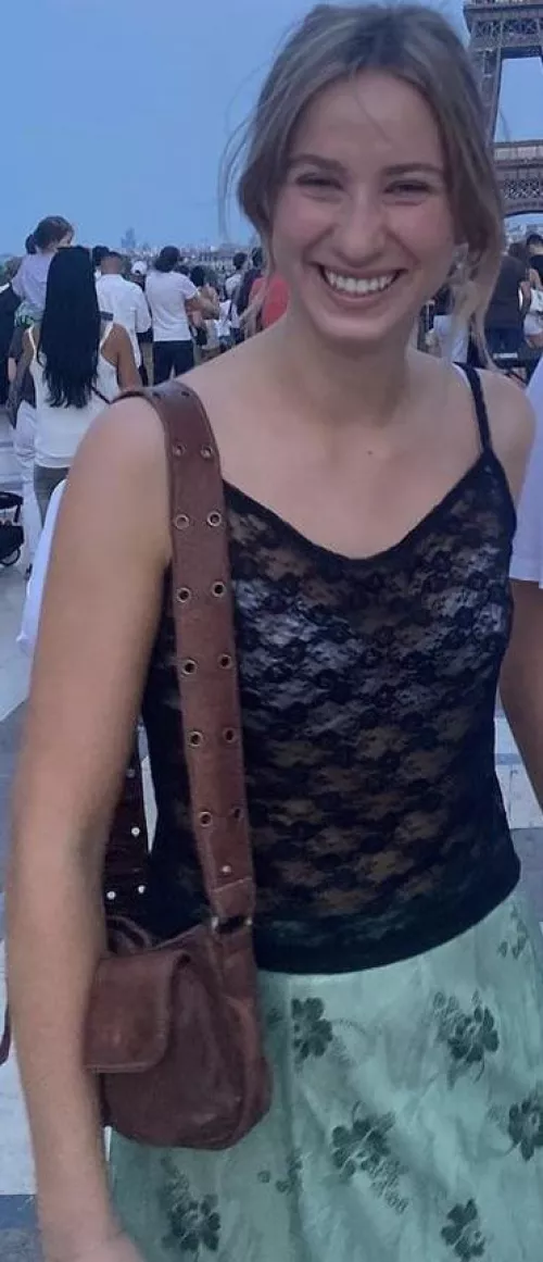 White bra under a black top