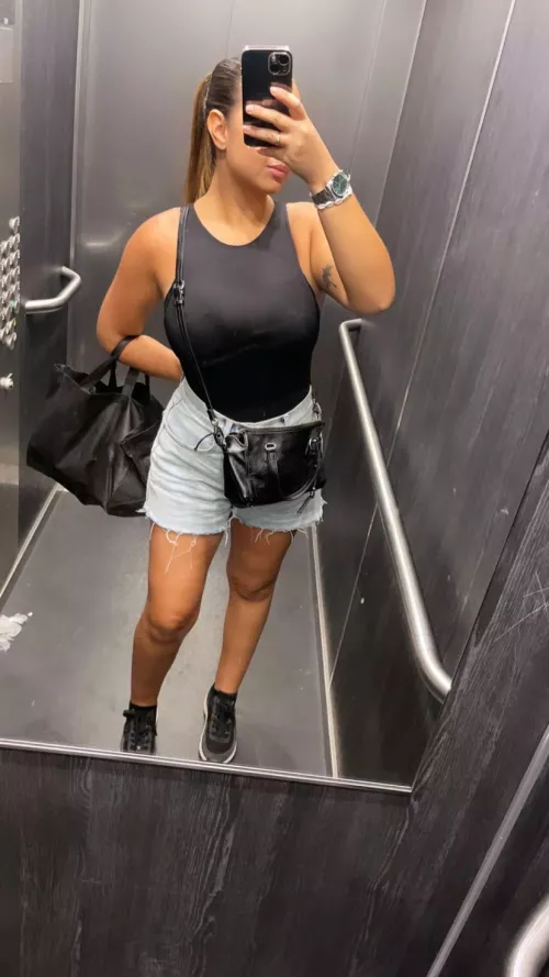 Stretching her top to the max.