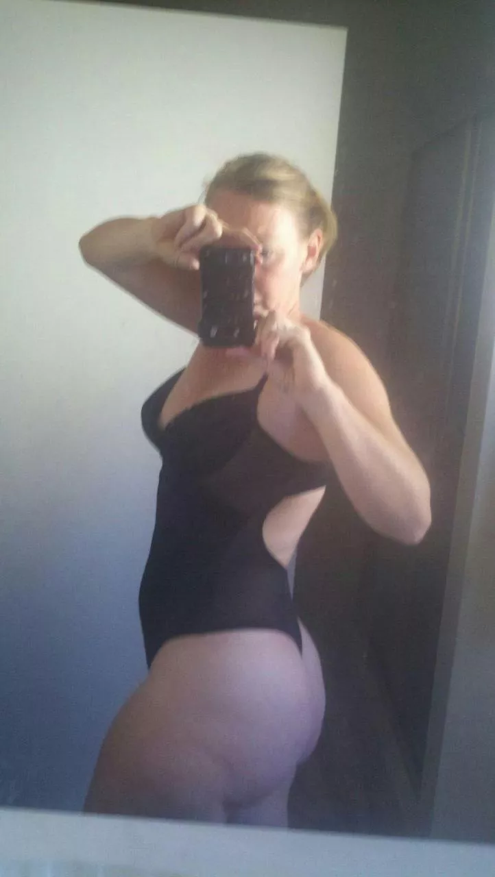 White cheeks against black lingerie-