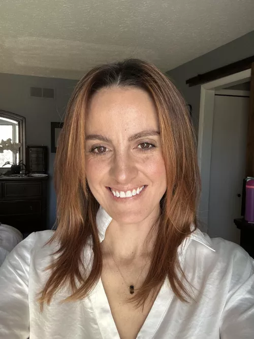 Showing 30s freckled face.