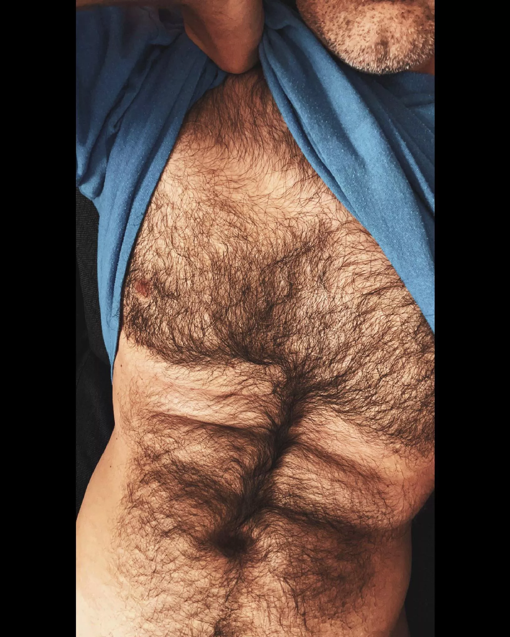 You never know what's hiding under a bloke's shirt...