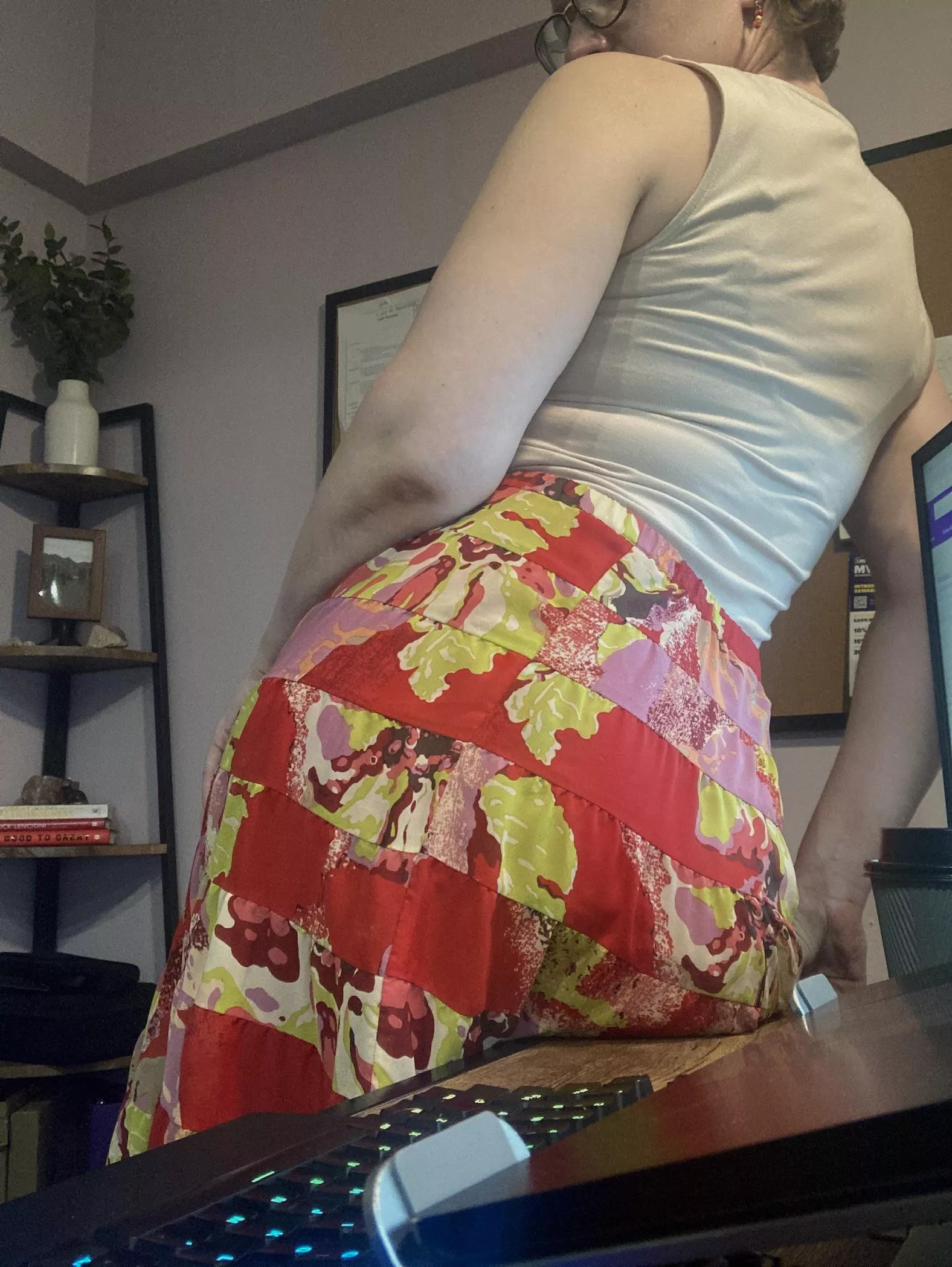 Nerdy gal with flashy pants showing off some back bra lines