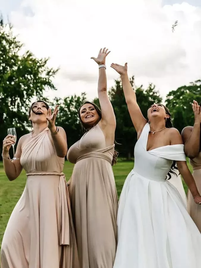 Bridesmaid hugely outsizing the bride here