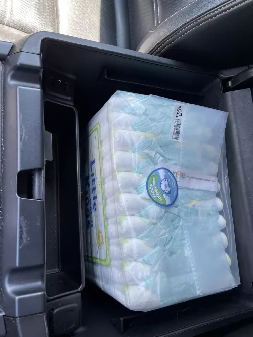 Does anyone else make good use of the massive storage in the center console of newer trucks? Incase anyone has ever wondered, a pack of diapers fits perfectly inside and its great😂