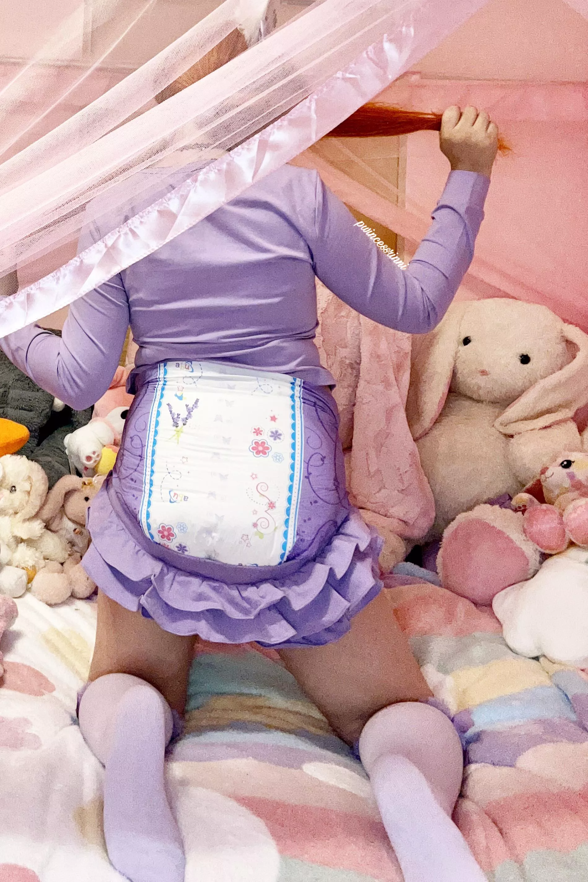 just a little enjoying her diapers and playtime 💜