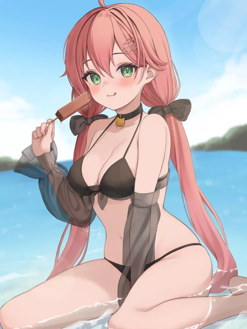 Enjoying a popsicle on her knees