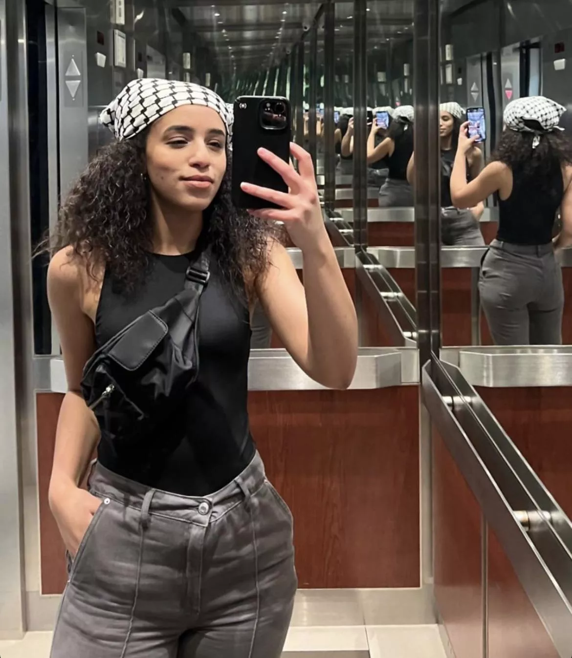 Curly haired beauty and her bootyful reflection