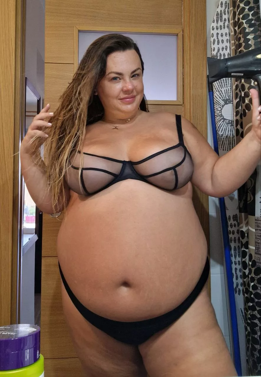 My big tits sit on my round, sexy belly