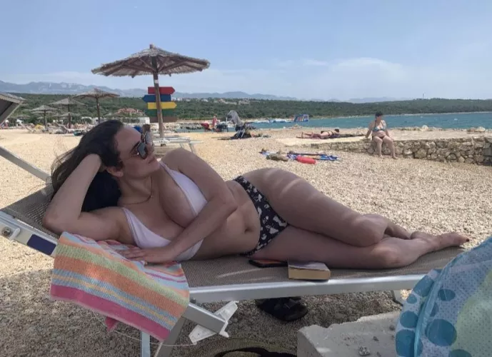 Big tits squeezed at the beach
