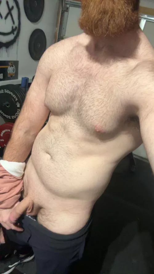 Garage gym in 100 degree weather means clothes come off