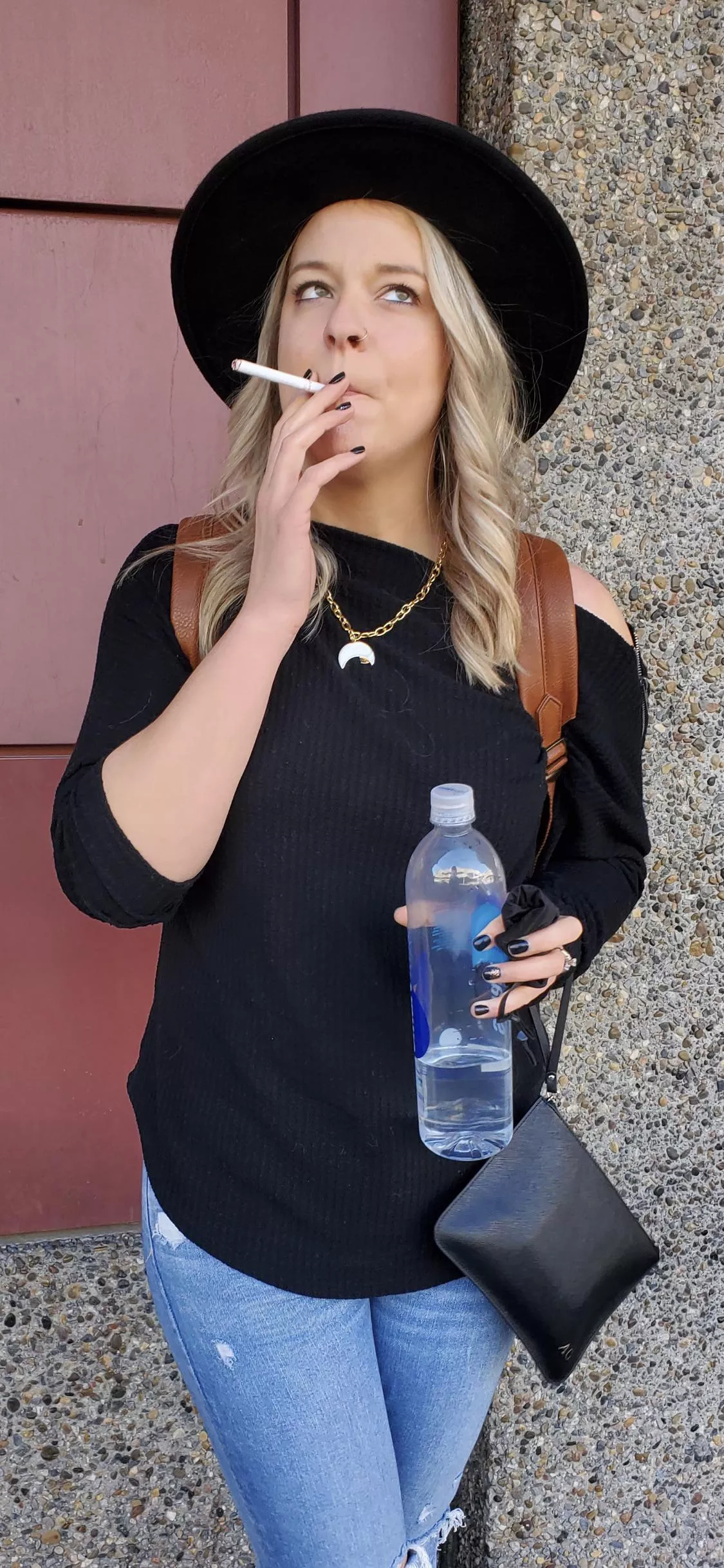 One last cigarette outside of the airport before hopping on a flight to start this weekend. Mini-vacation!!! TGIF babe!