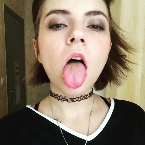 Sticking her tongue out
