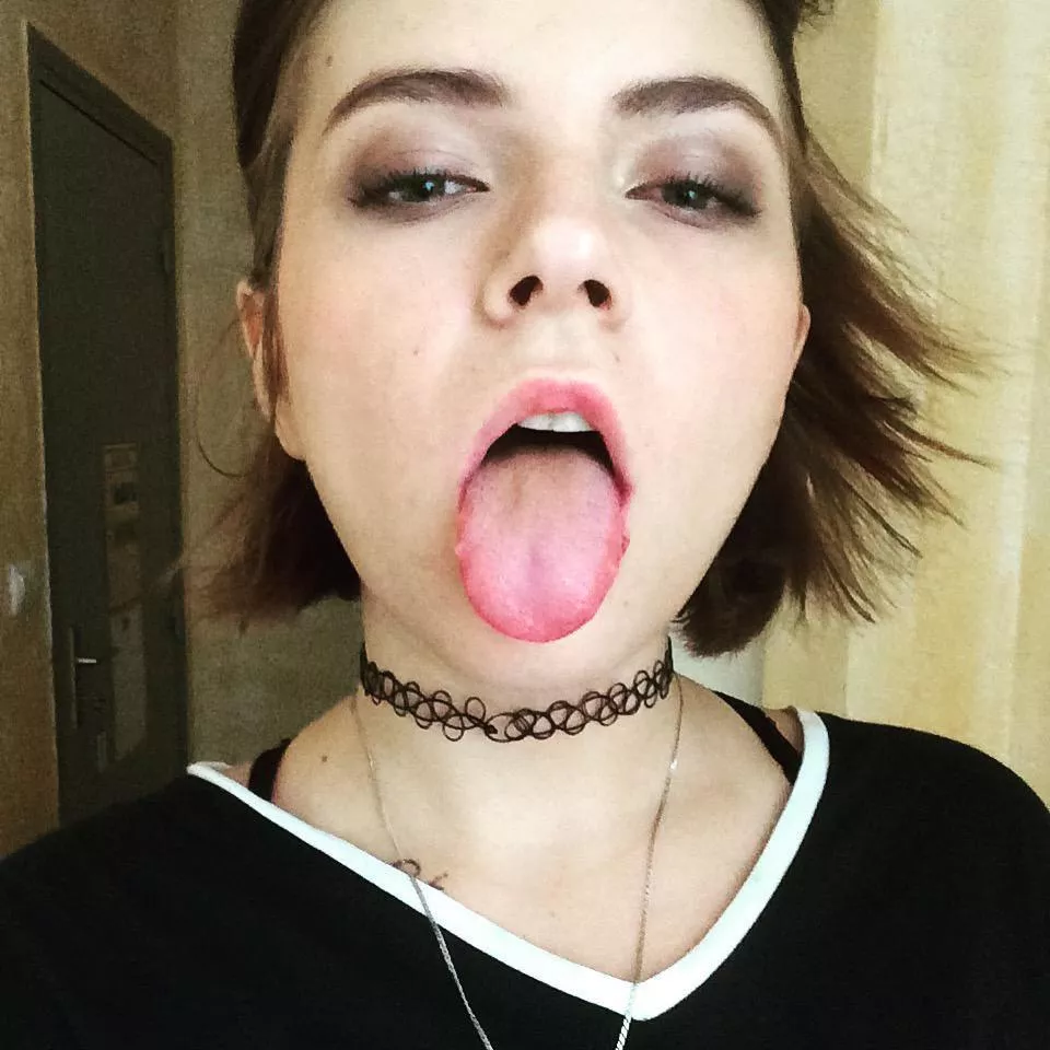 Sticking her tongue out
