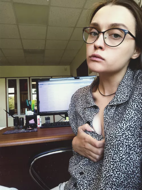 A secretary is more comfortable working without a bra