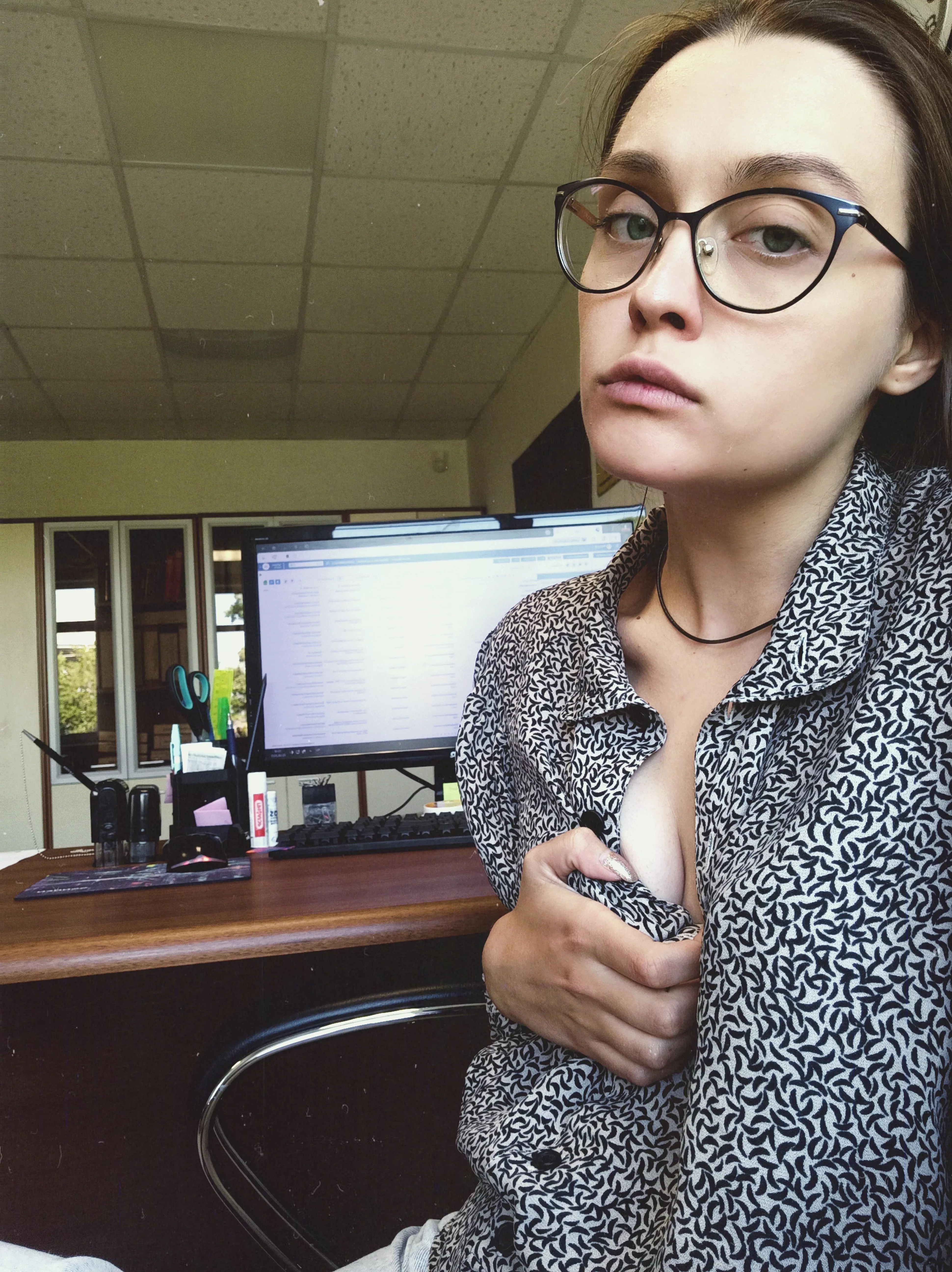 A secretary is more comfortable working without a bra