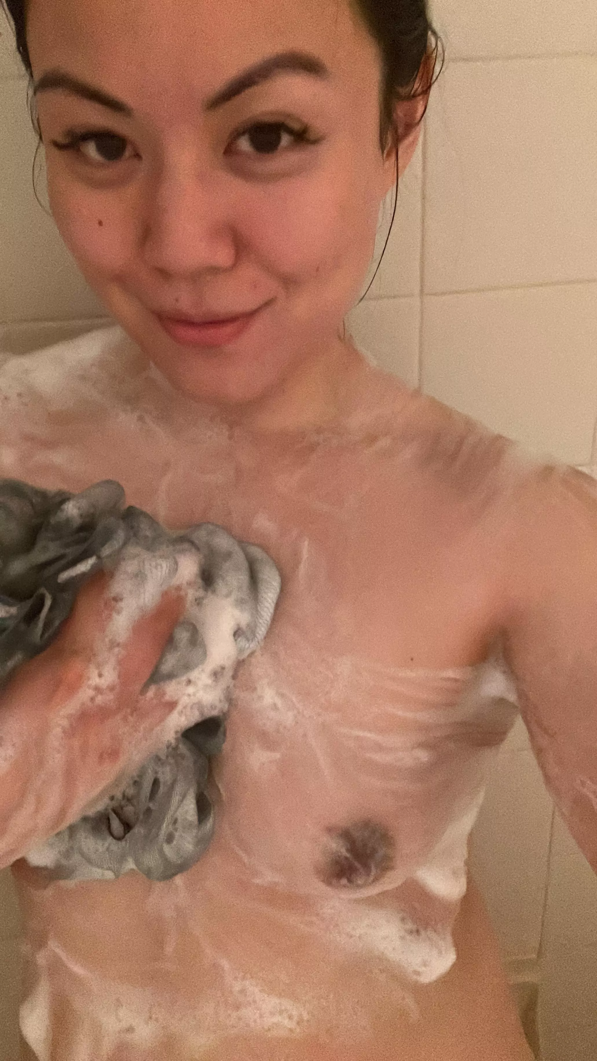 Friends scrub each others backs