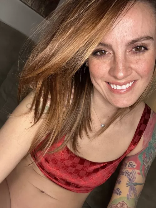 Teasing you through smile.